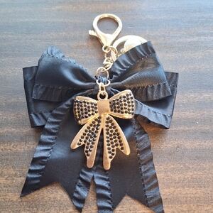 Elegant Black and Gold Bow Bag Charm